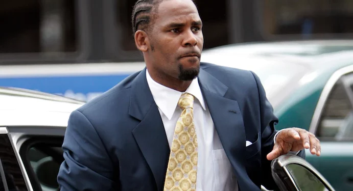 UPDATED: R. Kelly has been sentenced at last. Now a fully flagged ex-convict and jailed inmate. A tale of his long walk to jail